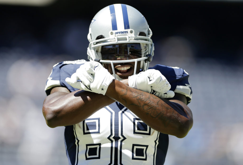 Dallas Cowboys wide receiver Dez Bryant reacts towards the fans during a warm up session before playing the San Diego Chargers in an NFL football game Sunday, Sept. 29, 2013, in San Diego. (AP Photo/Gregory Bull)