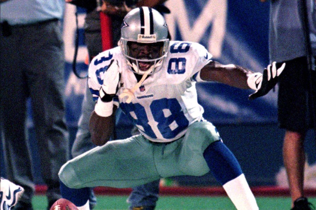 ** FILE ** Dallas Cowboys' Michael Irvin celebrates after gaining 30-yards on a Jason Garrett pass in the third quarter against the New York Giants in this Sept. 21, 1998 file photo, at Giants Stadium in East Rutherford, N.J. (AP Photo/Bill Kostroun, File)