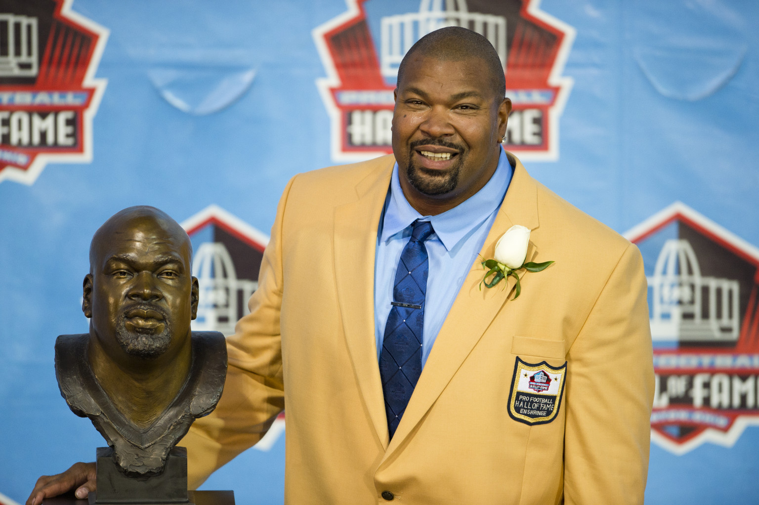 CANTON, OH - AUGUST 3: Former offensive lineman Larry Allen of the Dallas Cowboys poses with his Hall of Fame bust during the NFL Class of 2013 Enshrinement Ceremony at Fawcett Stadium on Aug. 3, 2013 in Canton, Ohio. (Photo by Jason Miller/Getty Images)