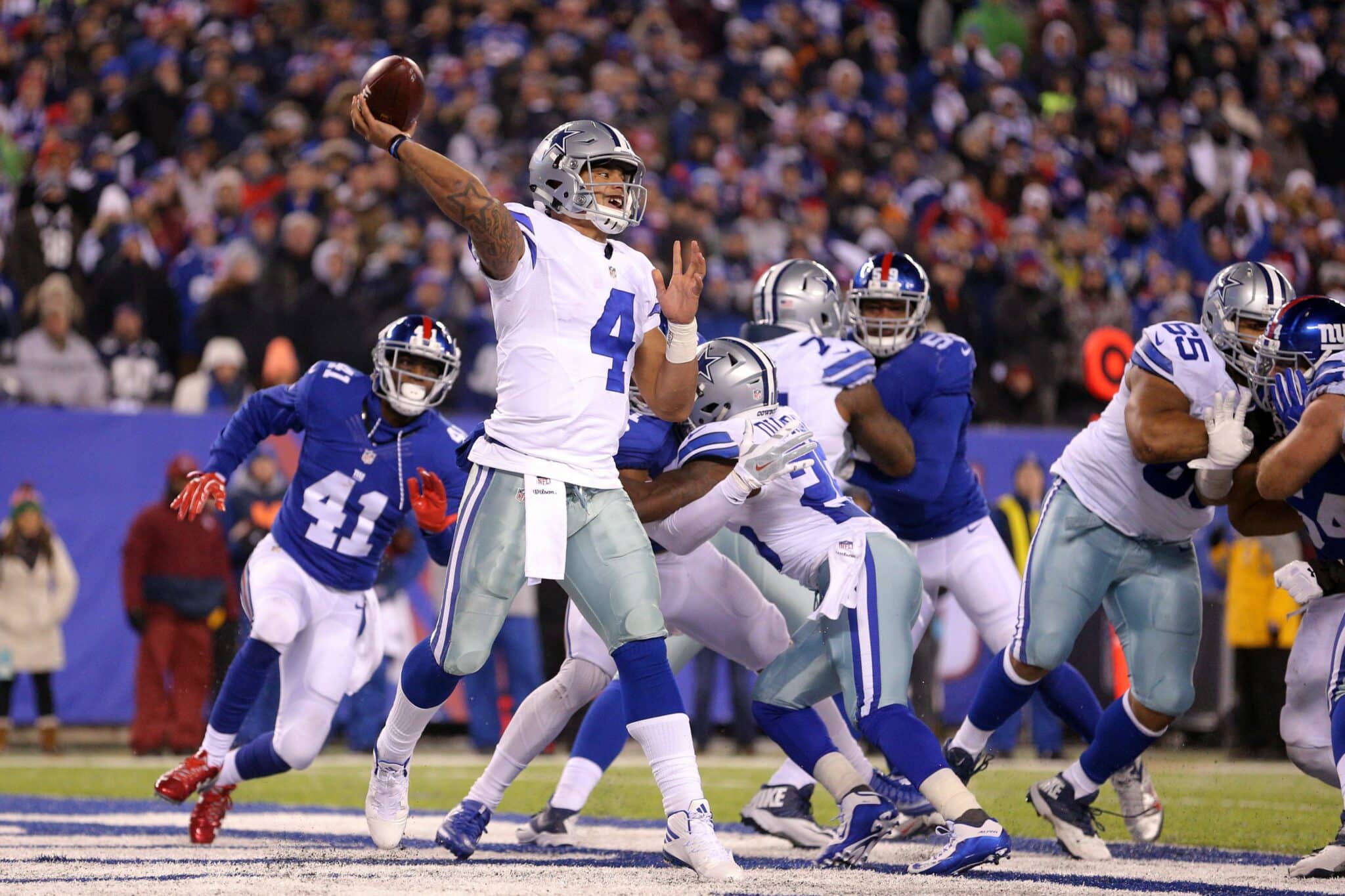 Dallas Cowboys Tony Romo runs out of the pocket in the first quarter  against the New York Giants in week 13 of the NFL season at Giants Stadium  in East Rutherford, New