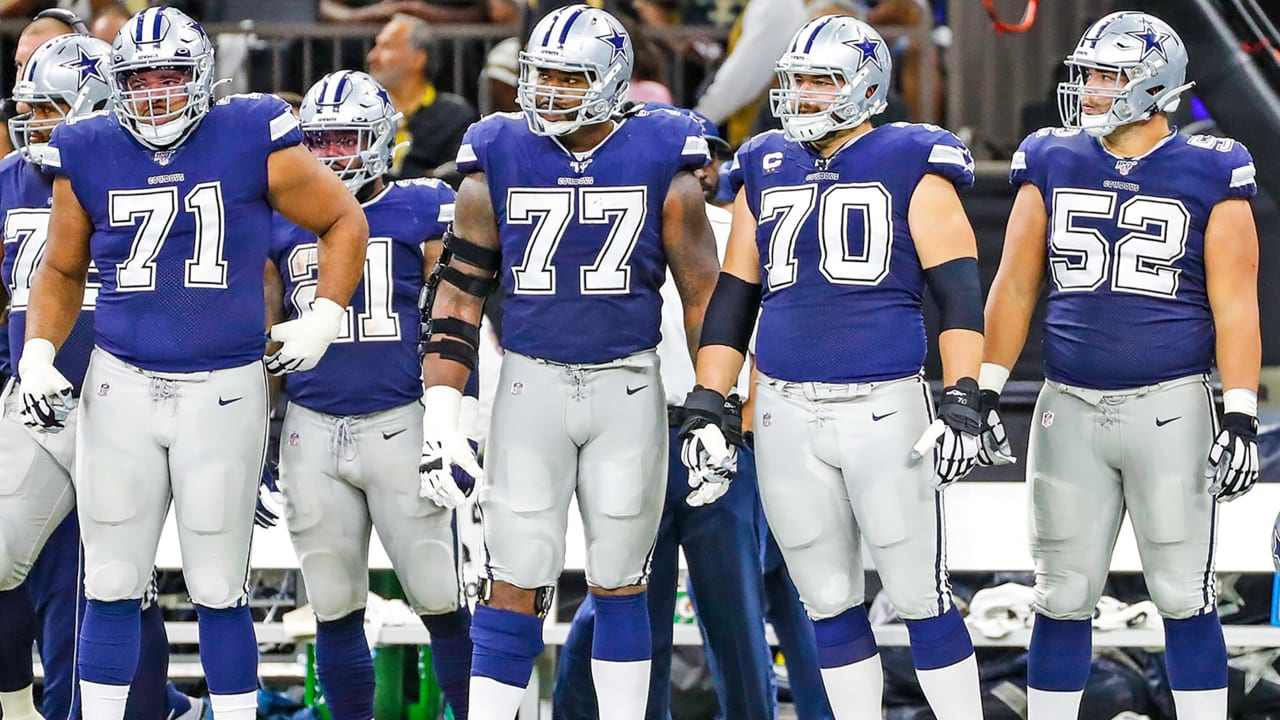 Dallas Cowboys center Tyler Biadasz (63) walks onto the field