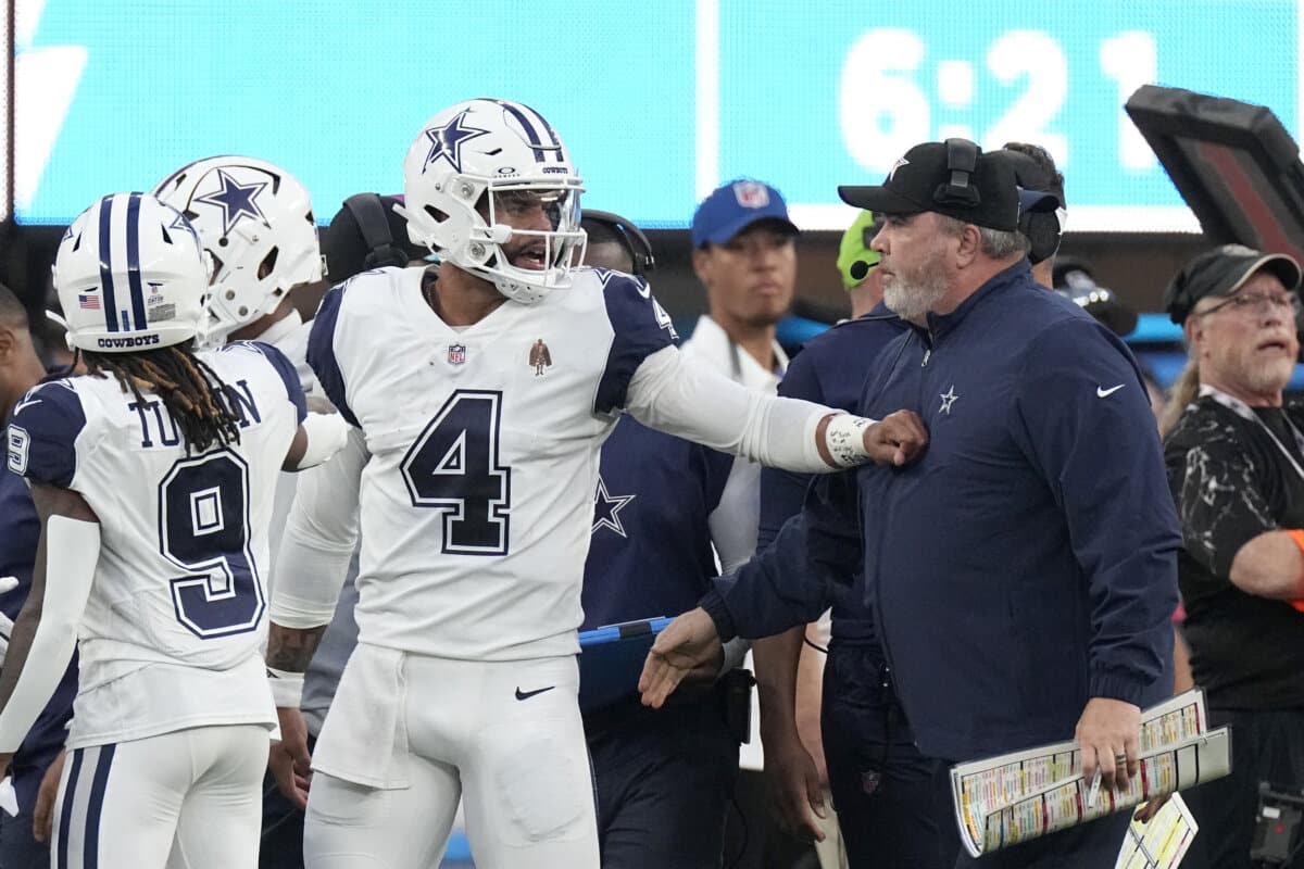 Dallas Cowboys quarterback Dak Prescott (4) talks with Cowboys head coach Mike McCarthy, right, during the first half of an NFL football game against the Los Angeles Chargers, Monday, Oct. 16, 2023, in Inglewood, Calif. (AP Photo/Mark J. Terrill)