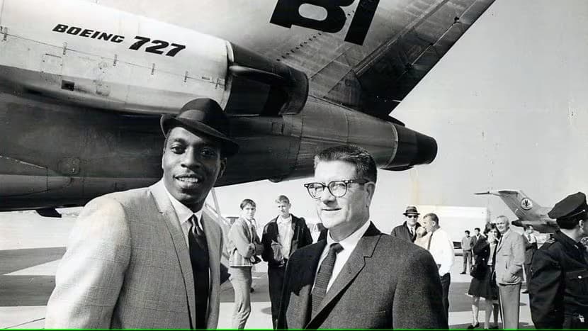 COwboys owner CLint Murchison Jr. stands in front of the Cowboys plane with Bob Hayes.

