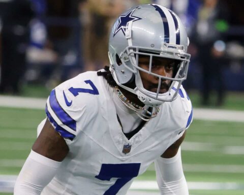 Football player in Dallas Cowboys uniform with number 7 on the field.