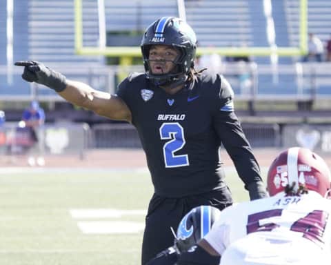 University at Buffalo linebacker Red Murdock (2) calls a play against Troy at UB Stadium.