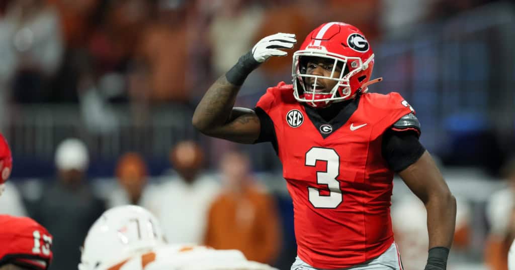 Georgia Bulldogs linebacker CJ Allen wearing a red No. 3 jersey reacts before the snap during an SEC game, featured in a 2026 NFL Mock Draft analysis.