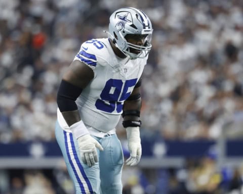 Kenny Clark lines up on the defensive front for the Dallas Cowboys, preparing for the snap in a home game.