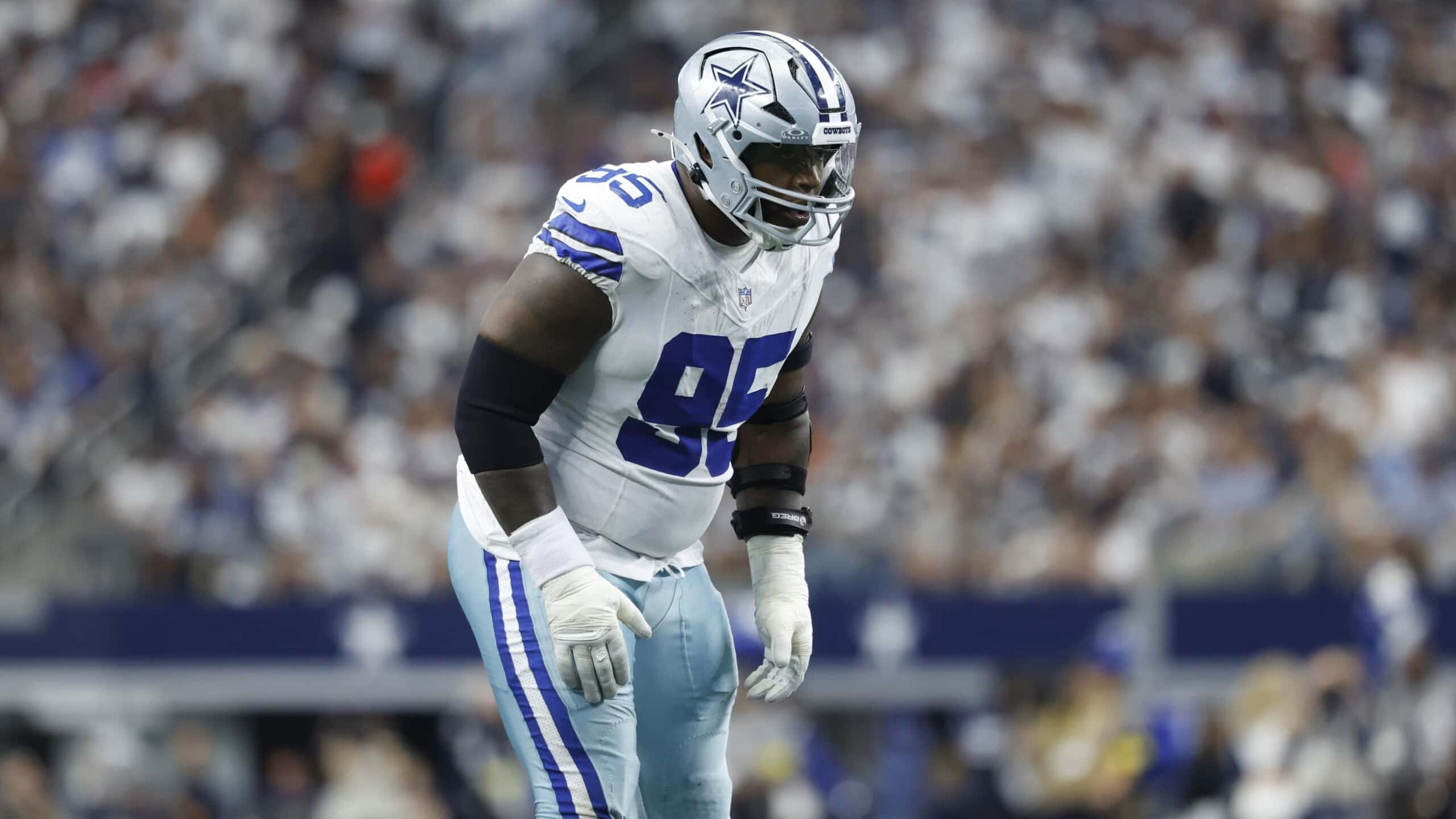 Kenny Clark lines up on the defensive front for the Dallas Cowboys, preparing for the snap in a home game.