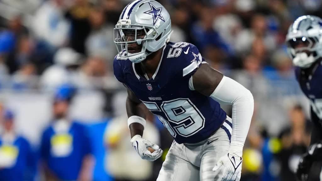 Dallas Cowboys linebacker wearing No. 59 lines up on defense during an NFL game at AT&T Stadium.