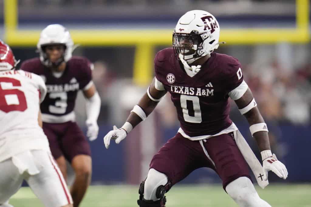 Scooby Williams in a Texas A&M uniform lined up at linebacker, reading the quarterback before the snap during an SEC matchup.