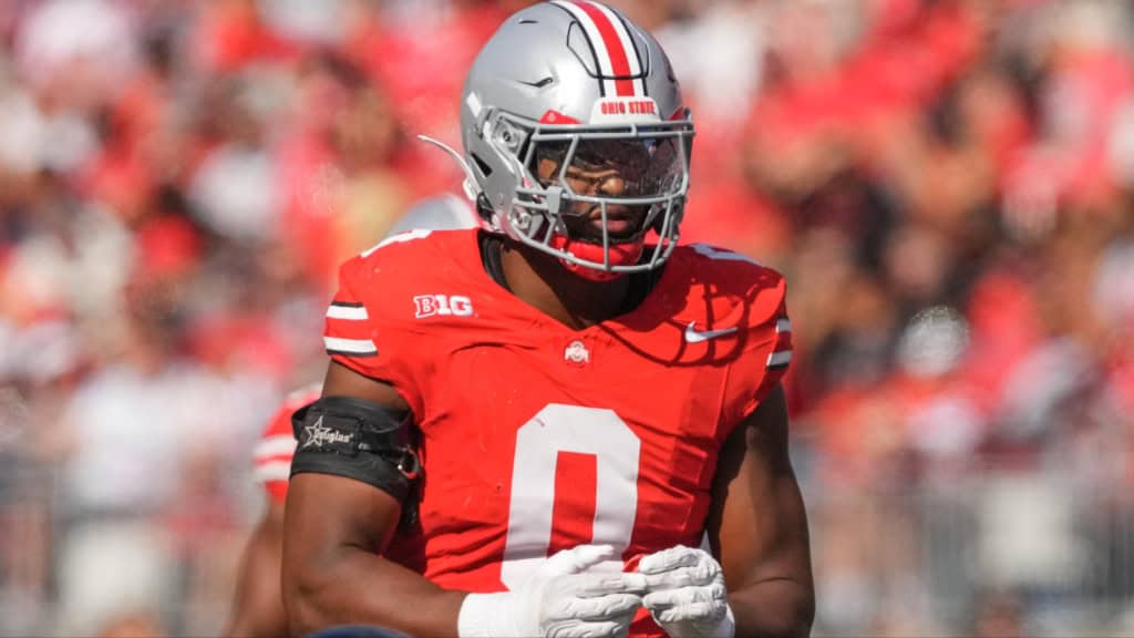 Ohio State Buckeyes linebacker wearing No. 0 prepares for the play during a Big Ten showdown.