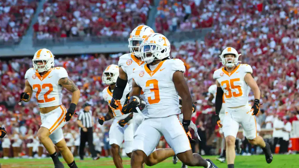 Jermod McCoy runs with the football after a turnover for Tennessee against Alabama.