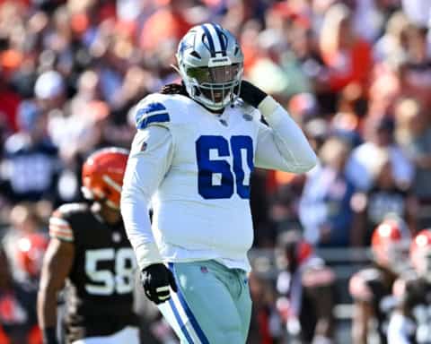Tyler Guyton stands on the field for the Dallas Cowboys before the snap
