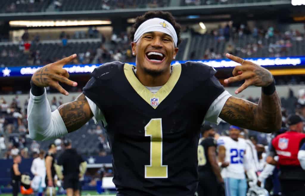 Alontae Taylor celebrating on the field in his New Orleans Saints uniform after a strong defensive performance.