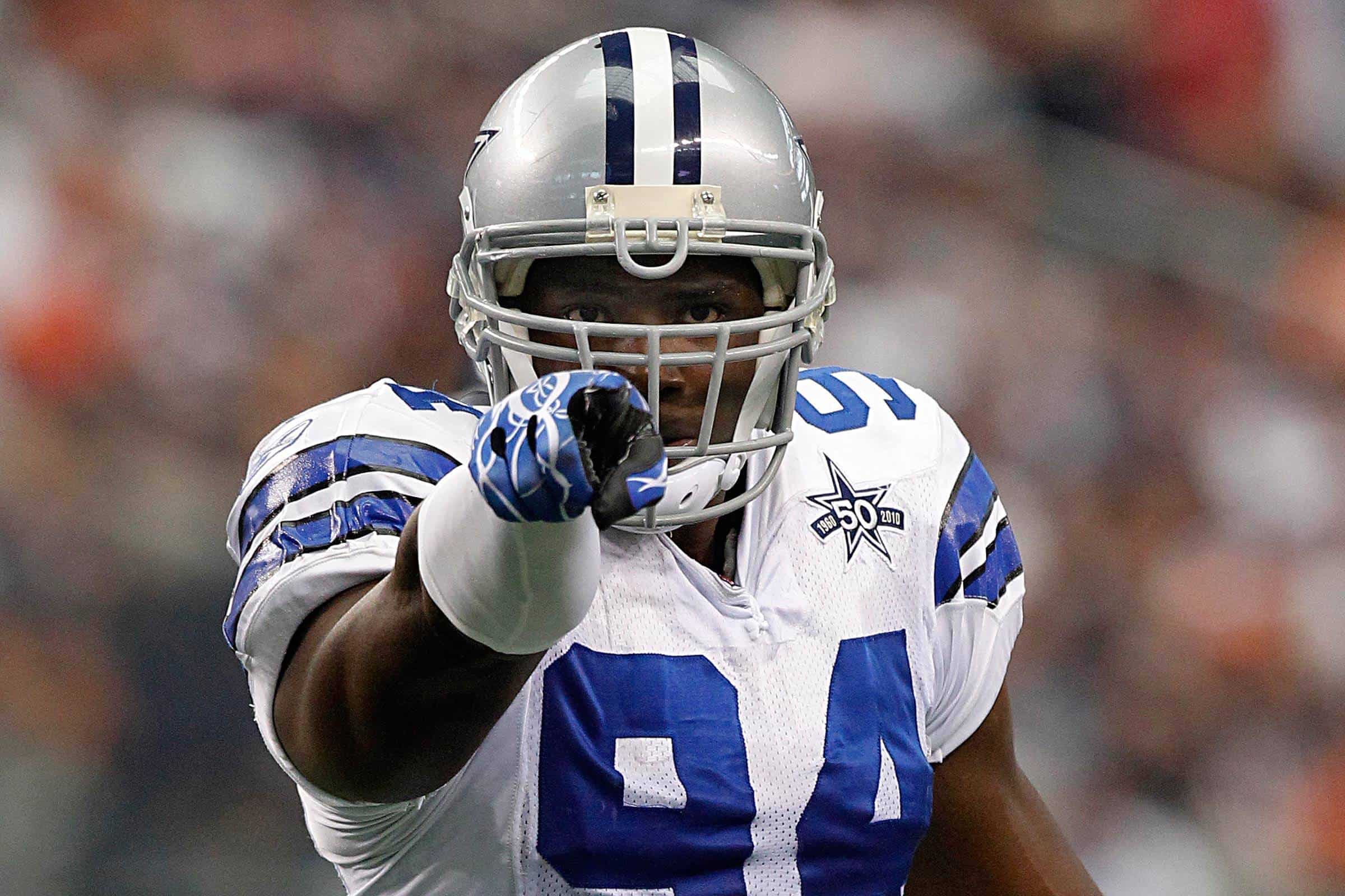 Dallas Cowboys first-round pick DeMarcus Ware pointing toward the camera during a game
