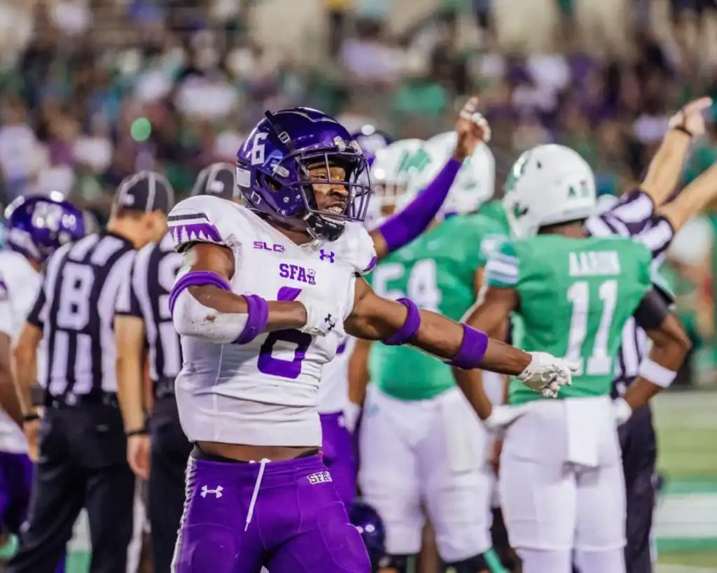 Stephen F. Austin defender celebrates during a game, possible Dallas Cowboys 30 Visit or Dallas Day Visit prospect evaluation