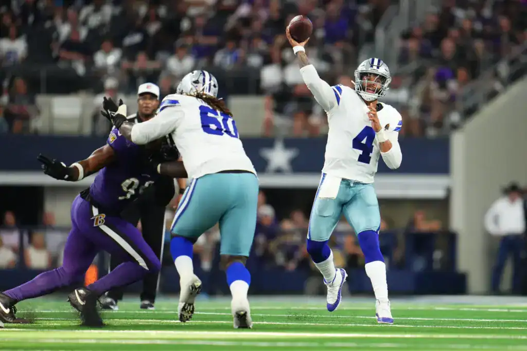 Tyler Guyton blocks for Dak Prescott during a Dallas Cowboys game