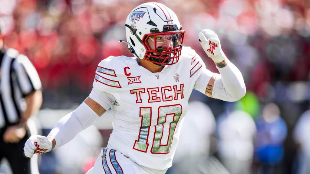 Texas Tech linebacker No. 10 celebrates a big defensive play, showcased as a rising defender in a 2026 NFL Mock Draft.