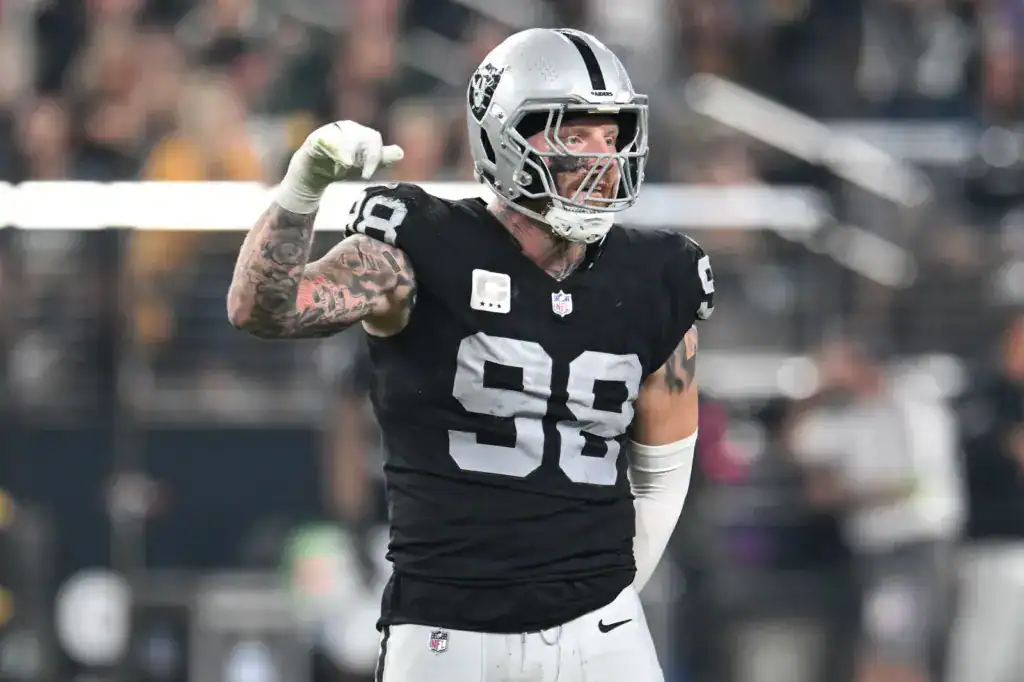 Raiders edge rusher Maxx Crosby celebrating a defensive stop during an NFL football game.