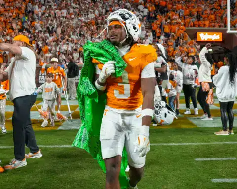 Jermod McCoy, Tennessee defensive back, walks off the field in an orange Volunteers uniform after a home game victory.