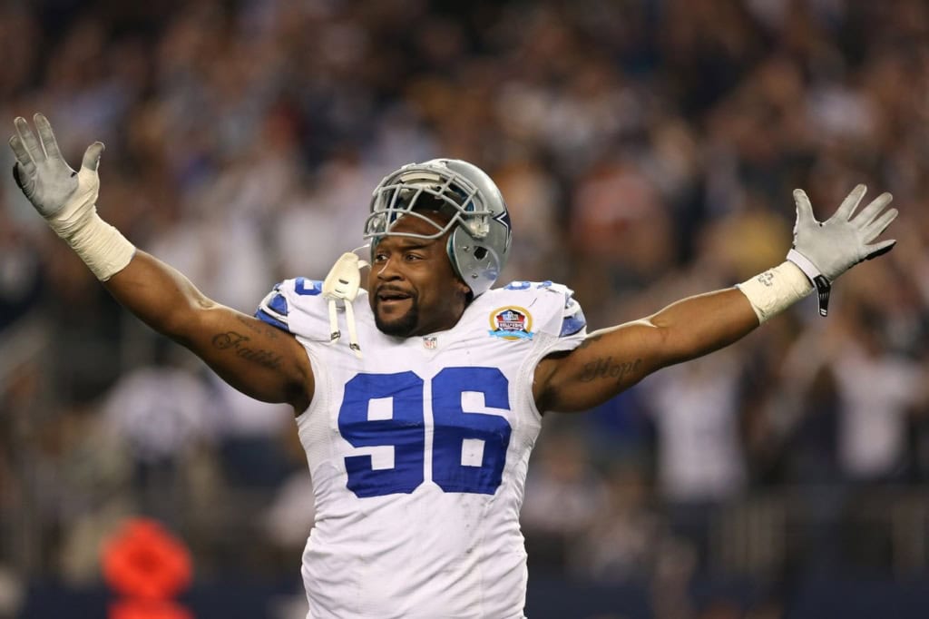Dallas Cowboys first-round pick Marcus Spears celebrating after a defensive play during an NFL game