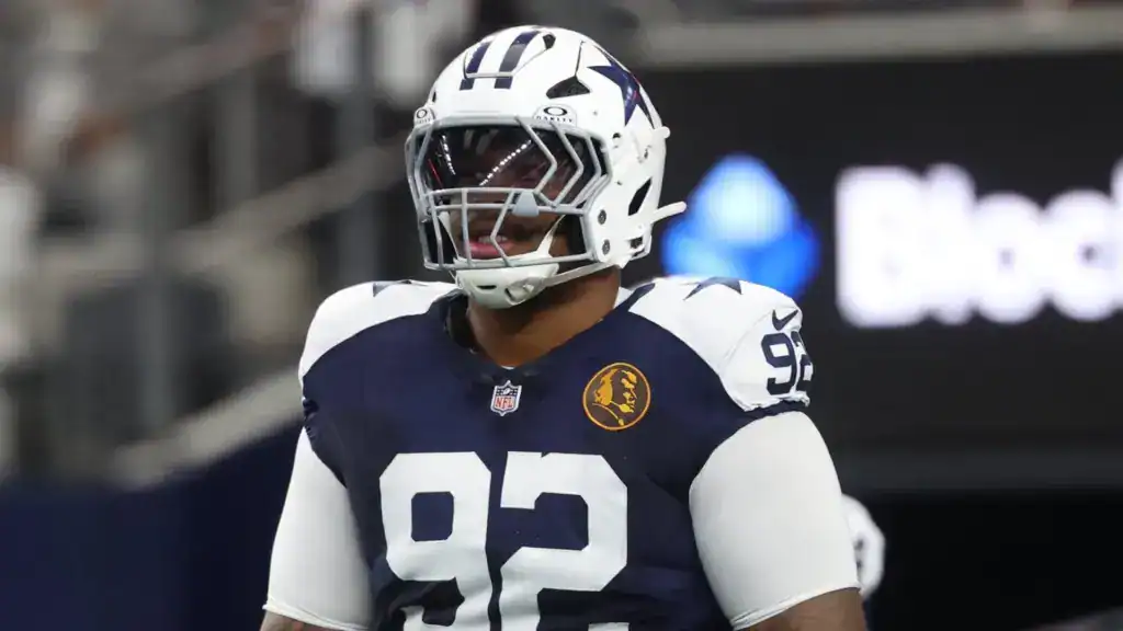 Dallas Cowboys defensive tackle Quinnen Williams walking on the field 