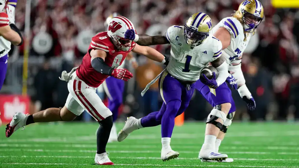 2026 NFL Draft prospect Jonah Coleman shown in action as he fights through traffic on a rushing attempt.