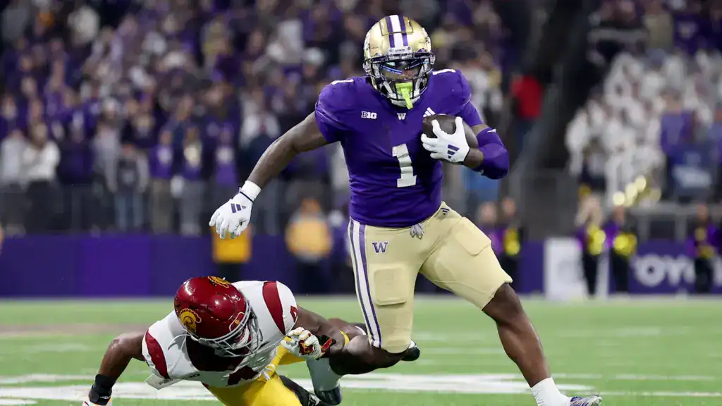 Jonah Coleman appears in game action as a 2026 NFL Draft prospect carrying the football upfield.