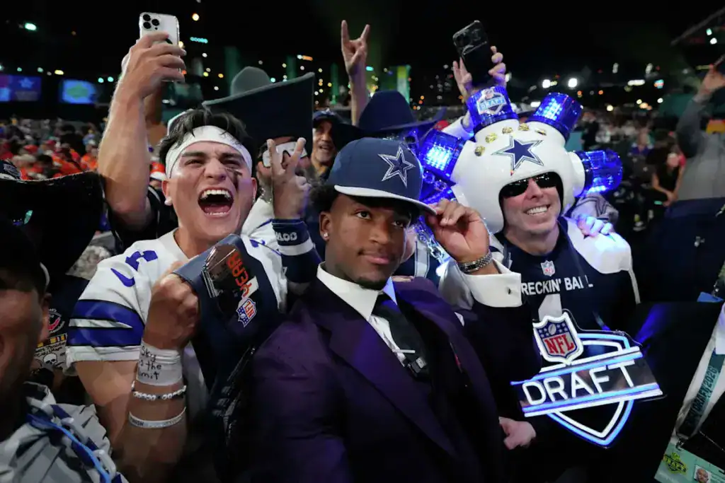 Rookie Caleb Downs poses with Dallas Cowboys fans after being drafted in the 2026 NFL Draft.