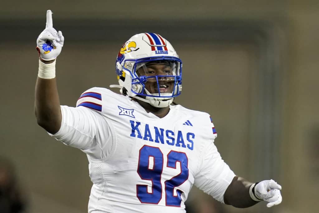 Kansas defensive lineman Tommy Dunn Jr. (#92) signals after a play, part of the Cowboys’ undrafted free agent class.