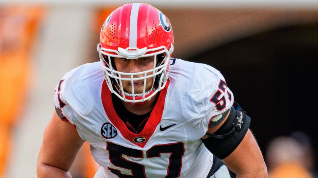 Monroe Freeling, Georgia offensive tackle and 2026 NFL Draft prospect, lines up before the snap in a white Bulldogs uniform.