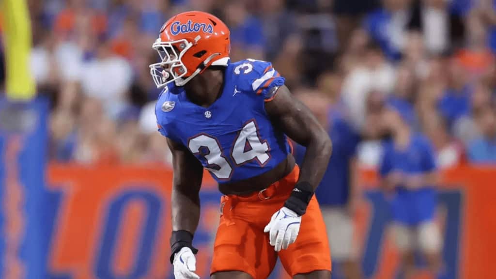 2026 NFL Draft sleeper George Gumbs Jr. lines up for Florida on defense, wearing a blue Gators jersey before the snap.