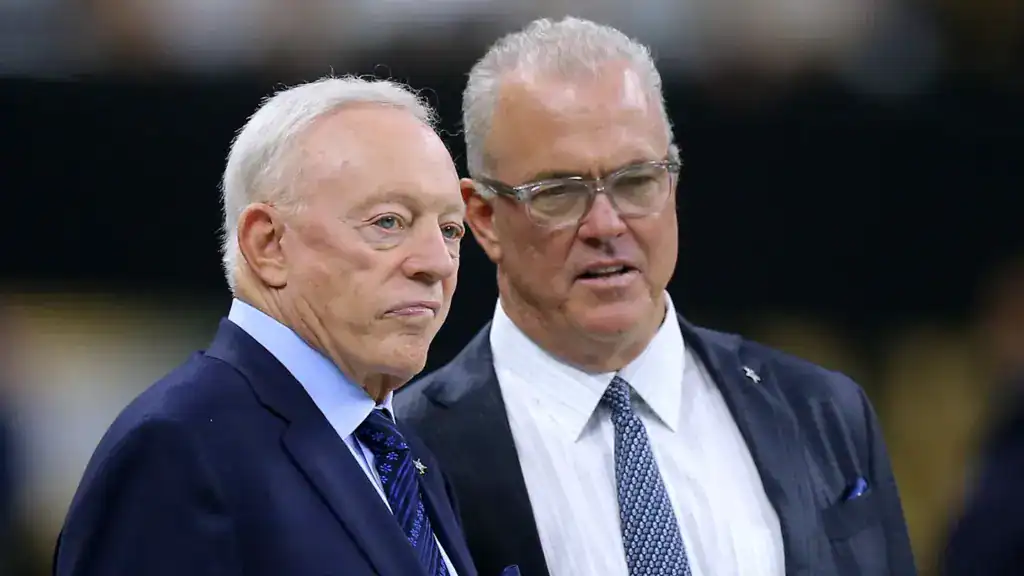 George Pickens contract extension alt text: Cowboys owner Jerry Jones stands beside executive Stephen Jones on the field, as Dallas leadership weighs a possible George Pickens contract extension.