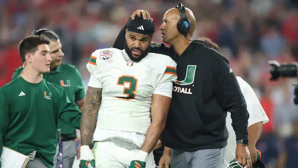 Akheem Mesidor's 2026 Draft Red Flag For Teams Like the Cowboys 2026 NFL Draft prospect Akheem Mesidor walks off the field in a Miami Hurricanes uniform while being helped by staff on the sideline.