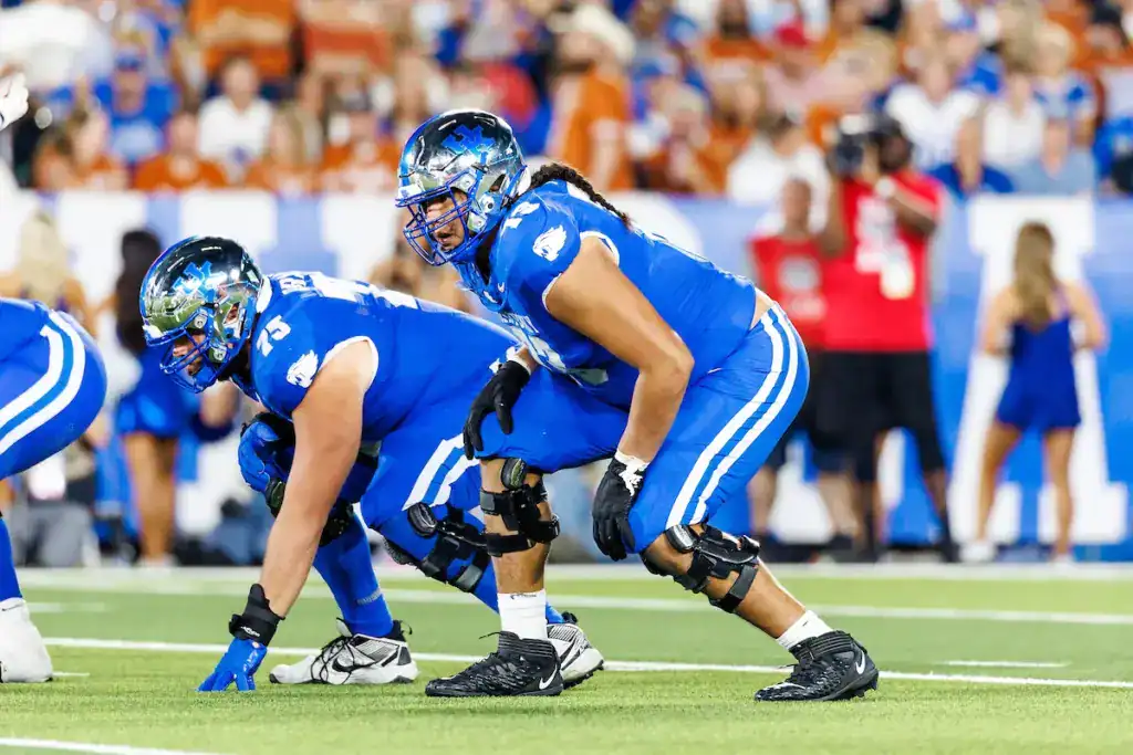 Offensive tackle Shiyazh Pete in pass protection during a college game, recently signed by the Dallas Cowboys as an undrafted free agent.