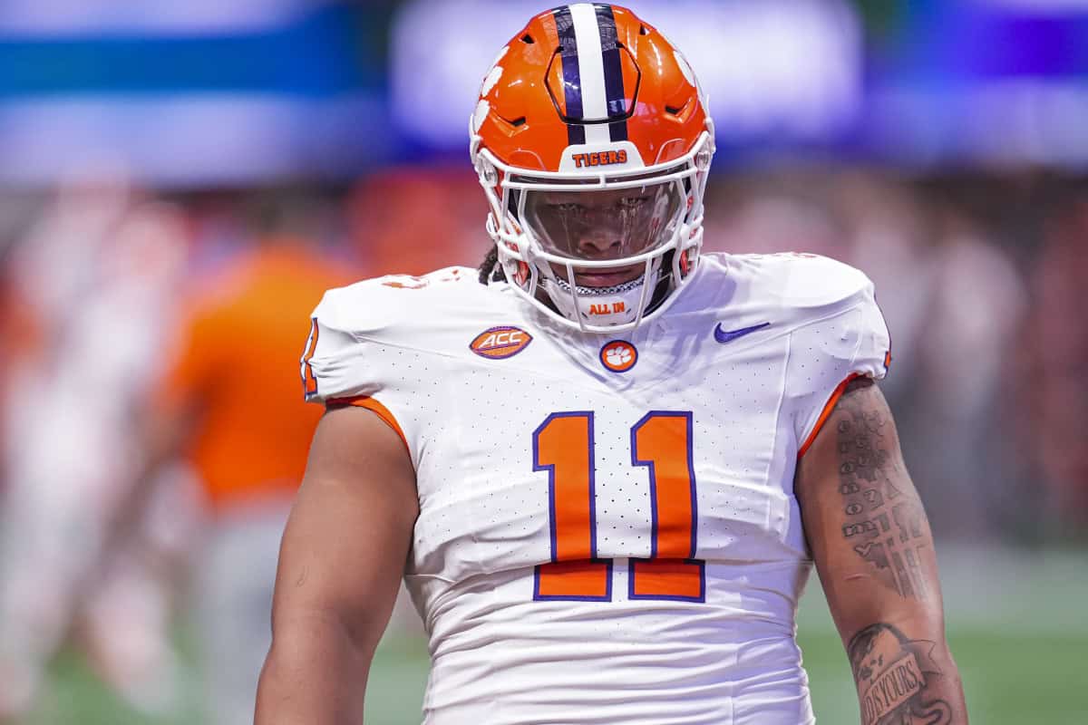 Dallas Cowboys Mock Draft target Peter Woods in Clemson white uniform before kickoff