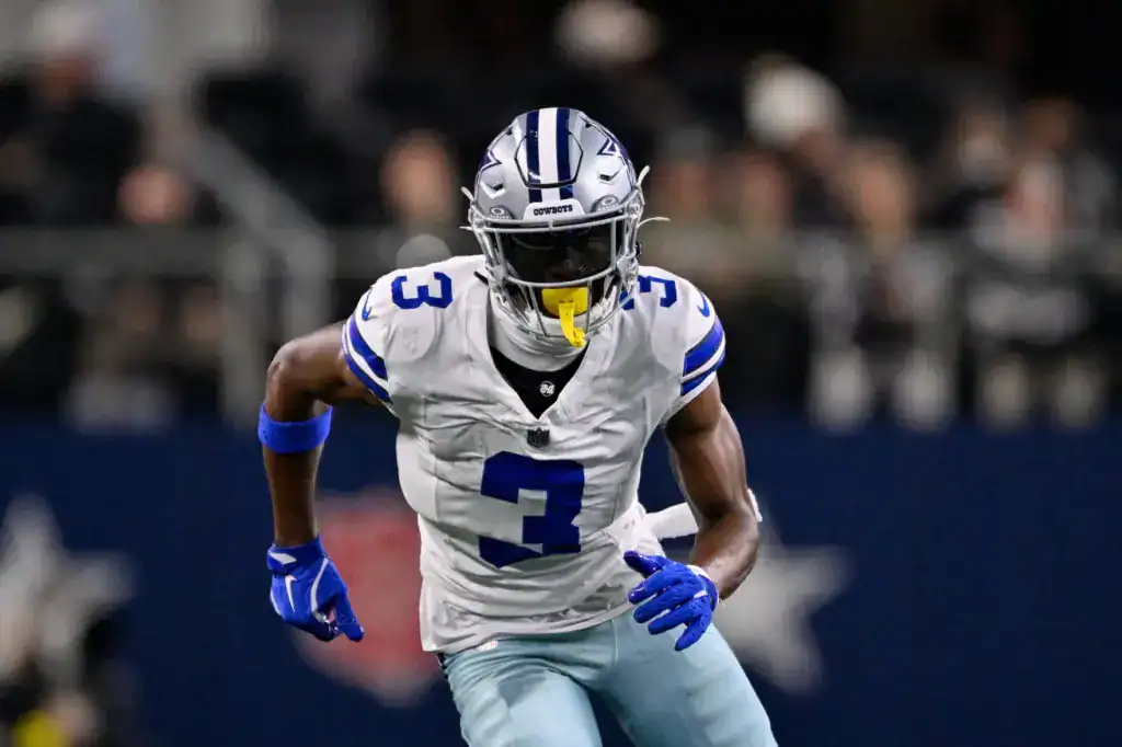 Dallas Cowboys wide receiver George Pickens running a route during a game, amid uncertainty as his franchise tag remains unsigned.