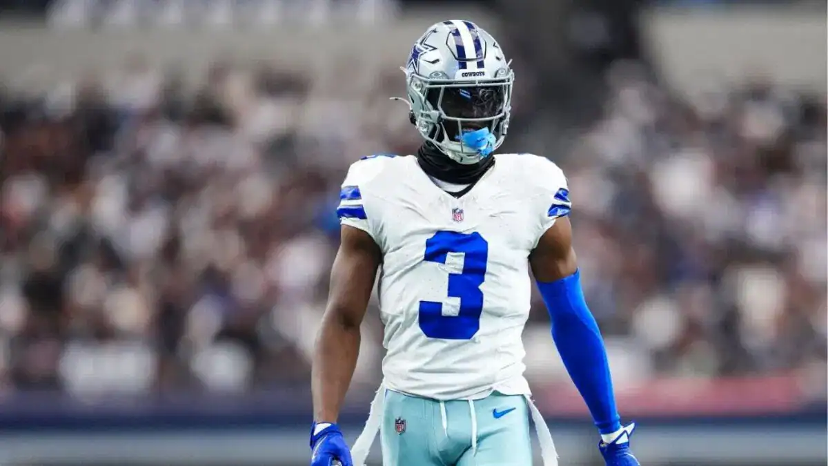 Dallas Cowboys wide receiver George Pickens standing on the field in his white Cowboys uniform, featured as part of the 2026 Offensive Depth Chart projection.