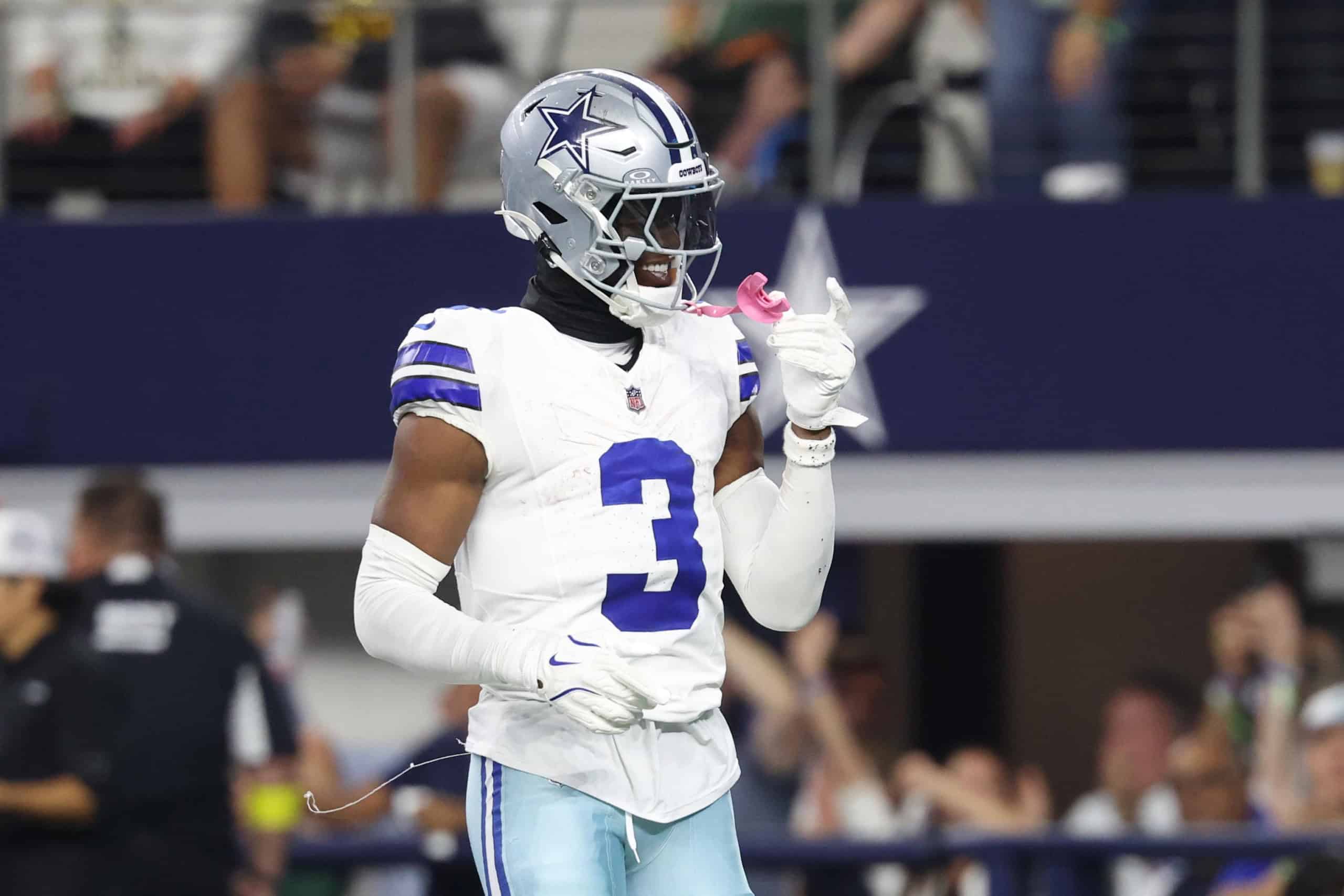 George Pickens reacting on the field in a Cowboys uniform, with ongoing speculation surrounding his decision not to sign the franchise tag.