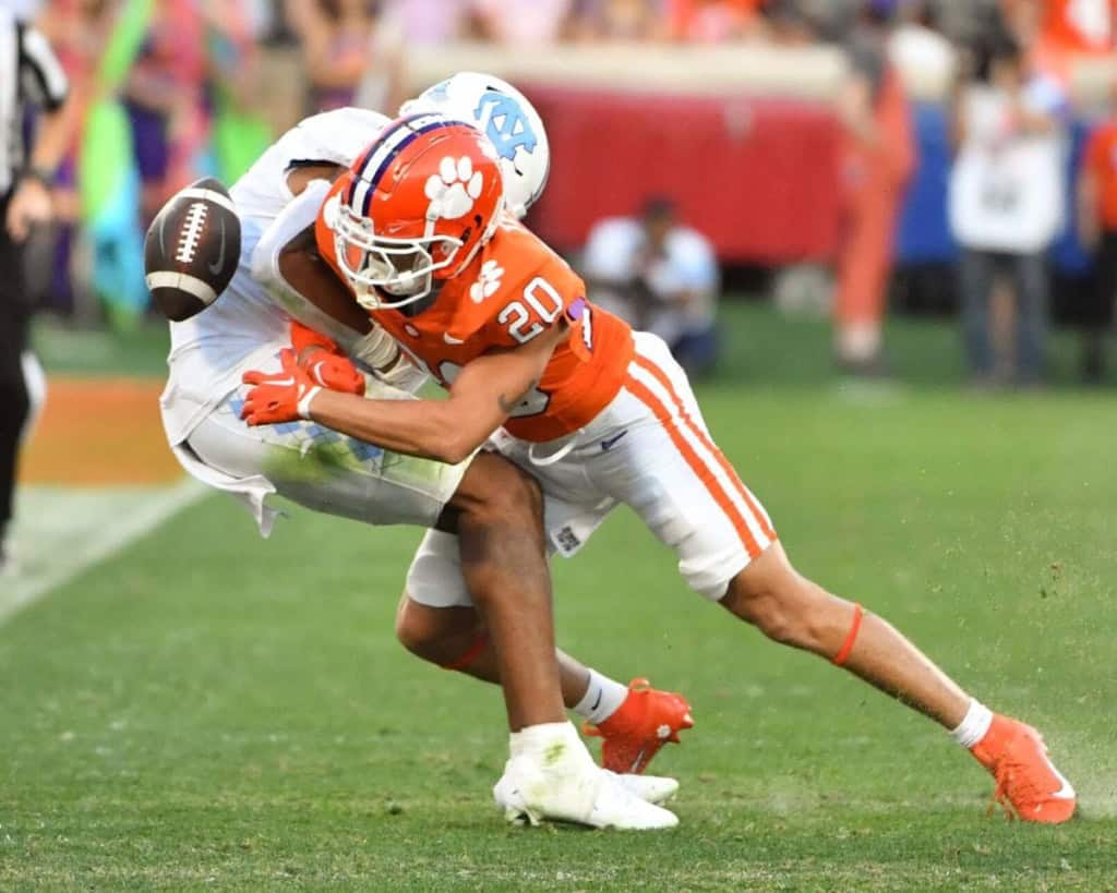 Clemson cornerback Avieon Terrell wraps up a North Carolina ball carrier near the sideline.