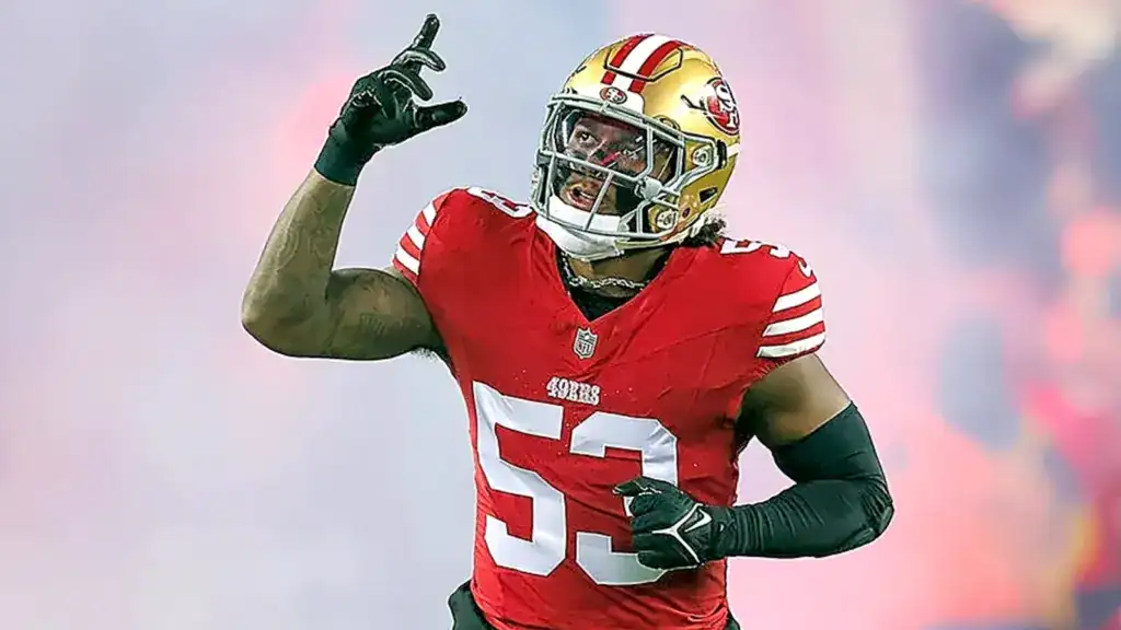 Dee Winters 49ers linebacker pointing upward in game action Cowboys trade news