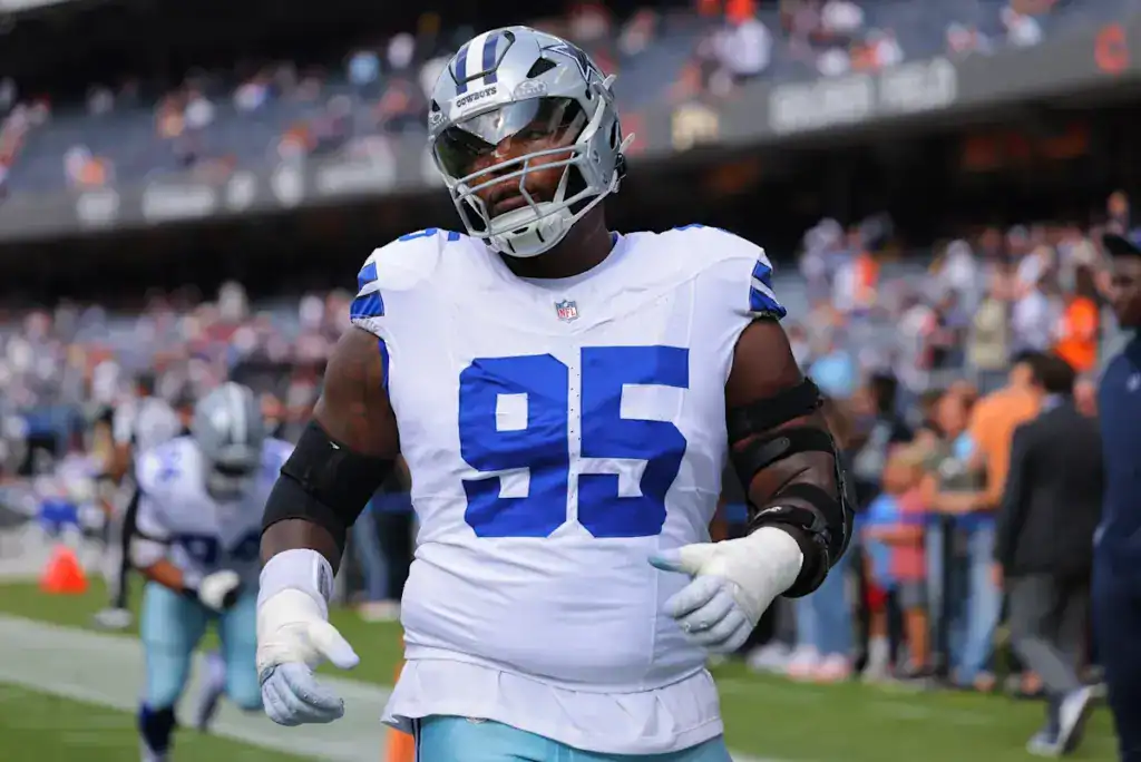 Kenny Clark walks off the field in a Dallas Cowboys uniform after being part of the Micah Parsons trade recap.