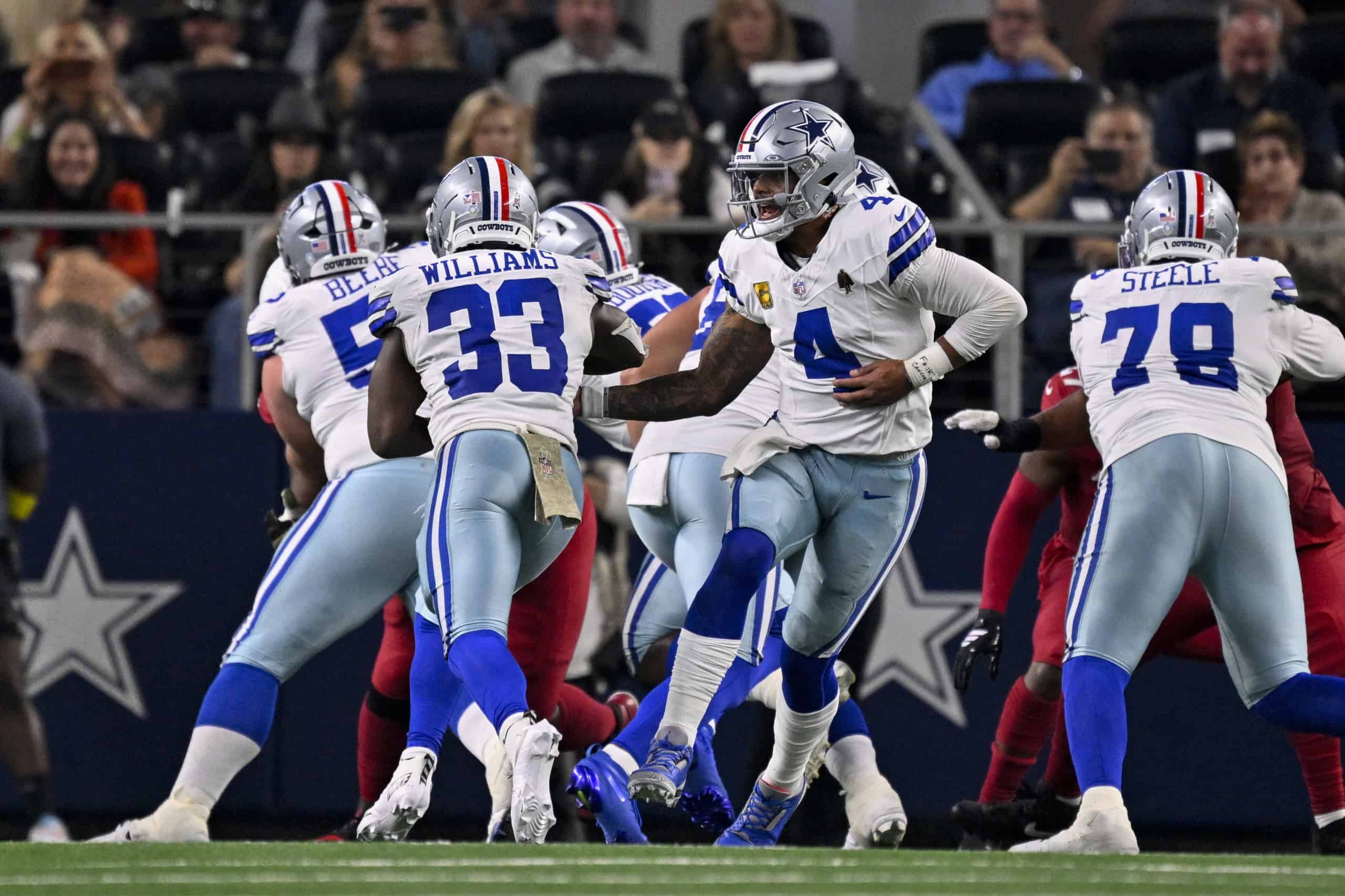 Dallas Cowboys quarterback Dak Prescott runs the offense behind Terence Steele and the offensive line, with Javonte Williams in the backfield, as the team looks to build toward a strong 2026 record prediction.