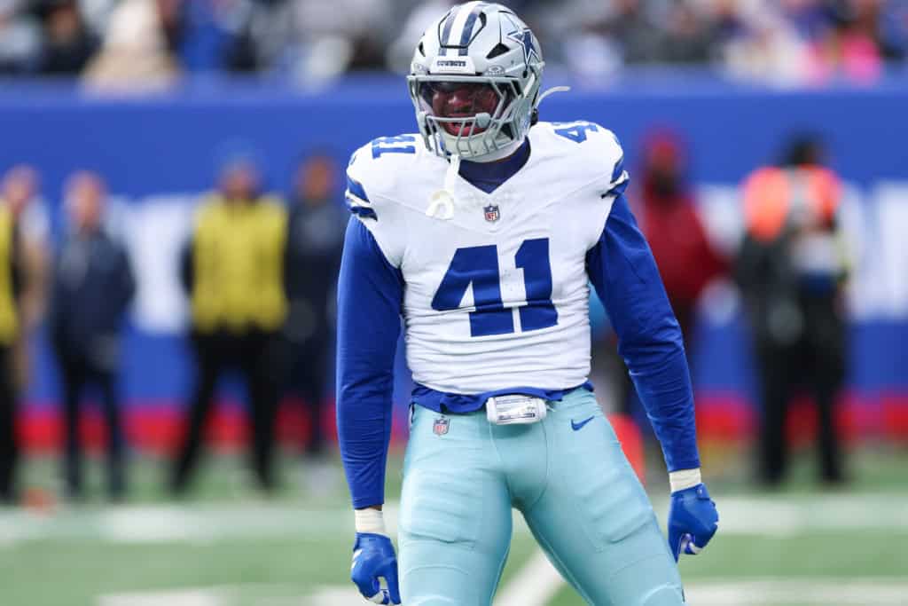 Dallas Cowboys defender Donovan Ezeiruaku stands on the field in uniform as part of the Cowboys defense.