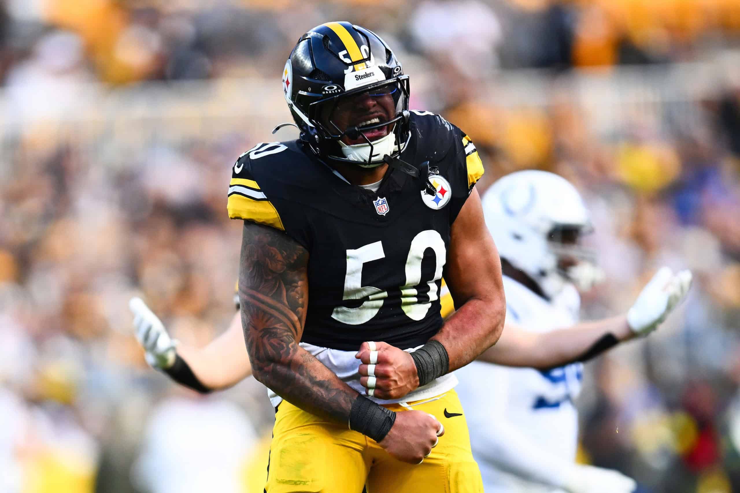 Malik Harrison celebrates in a Pittsburgh Steelers uniform while being discussed as a potential June 1st cut.
