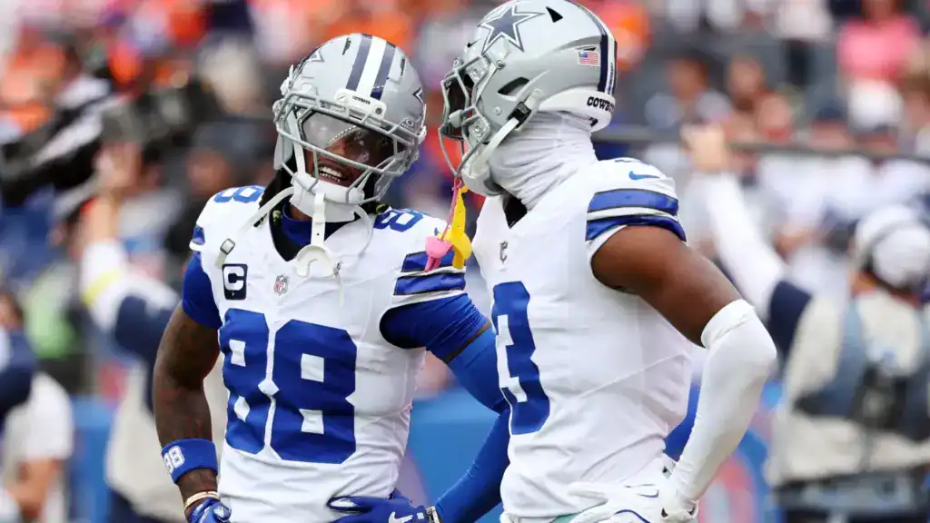 Dallas Cowboys wide receivers CeeDee Lamb and George Pickens celebrate together, giving Dak Prescott two major passing-game weapons for the Cowboys’ 2026 season record prediction.