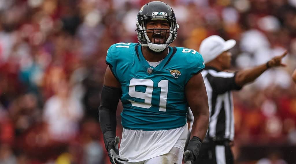 Veteran free agent defensive end Dawuane Smoot celebrates during an NFL game in a Jacksonville Jaguars uniform.