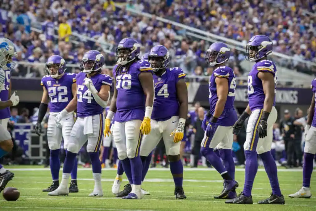 Minnesota Vikings defense lined up on the field during a game against the Lions.

