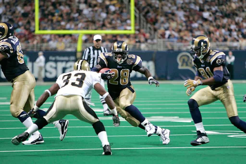 NFL History Shows Cowboys Defense Can Spark 2026 Turnaround St. Louis Rams running back No. 28 carries the ball in a historical NFL matchup, tying past team trends to the Cowboys’ 2026 outlook.
