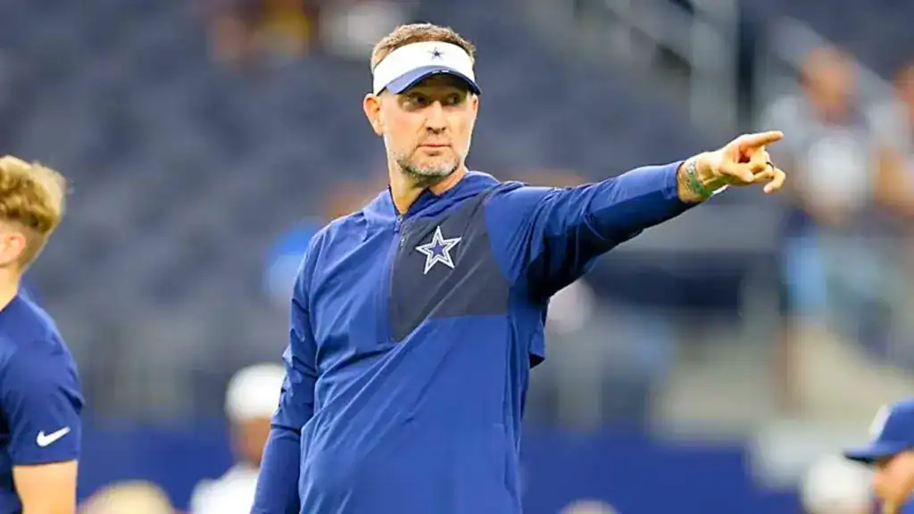 Dallas Cowboys coach pointing during practice as the offense looks to sharpen execution before the season.